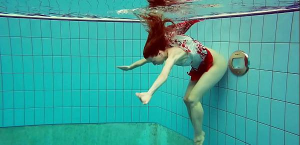 Hairy brunette teen Marketa underwater swimming